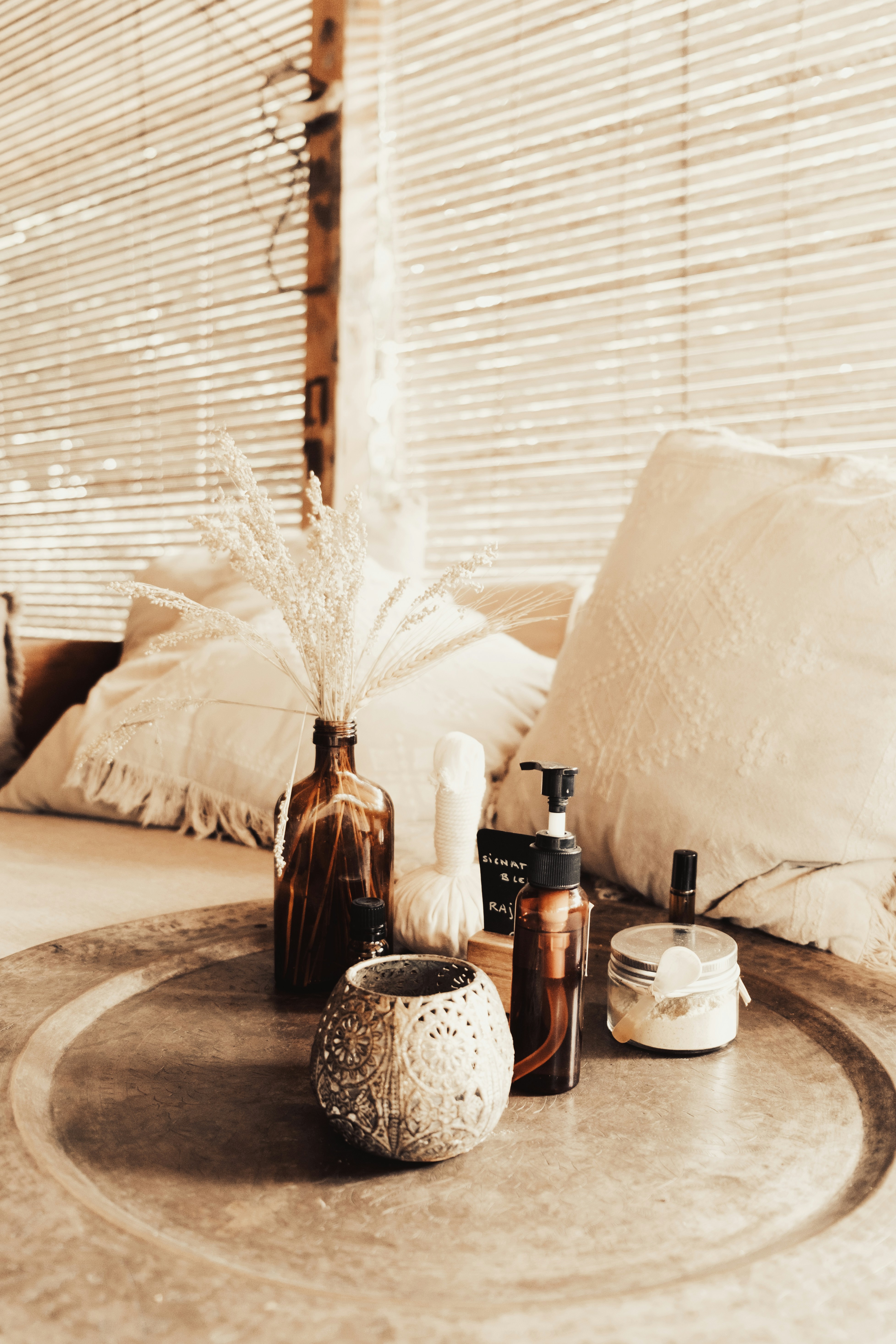 Massage oil being poured for a therapy session